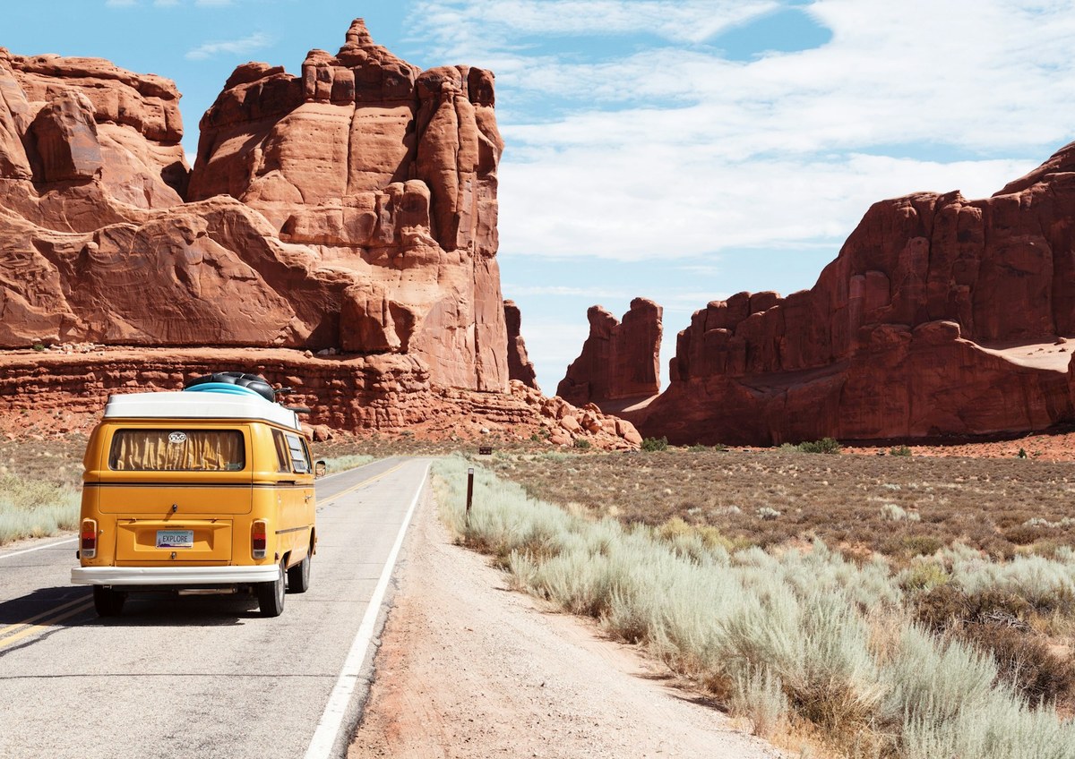 Scenic Utah desert highway toward red rock formations