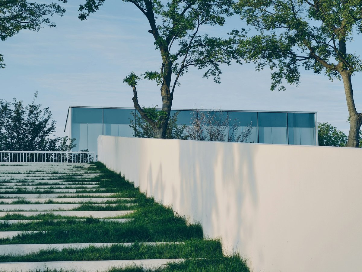 Modern home exterior with clean landscaping under a clear sky, used to illustrate mortgage rate buydown payment planning