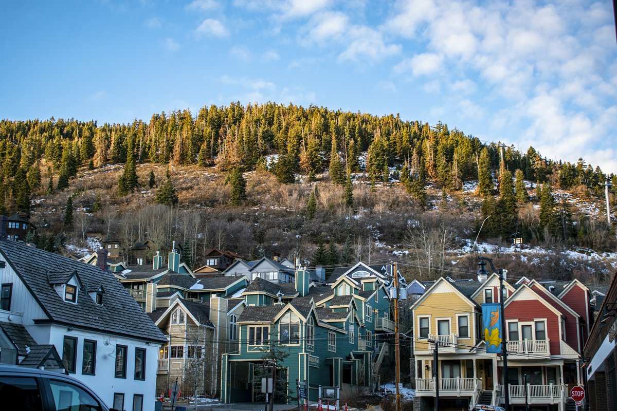 Colorful mountain-town homes along a Wasatch Front street in fall, representing higher Utah housing inventory in October 2026