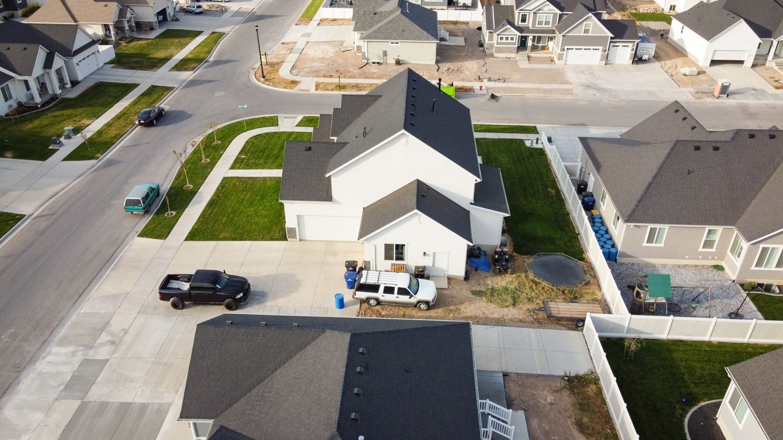 Aerial view of a residential neighborhood with tree-lined streets and single-family homes