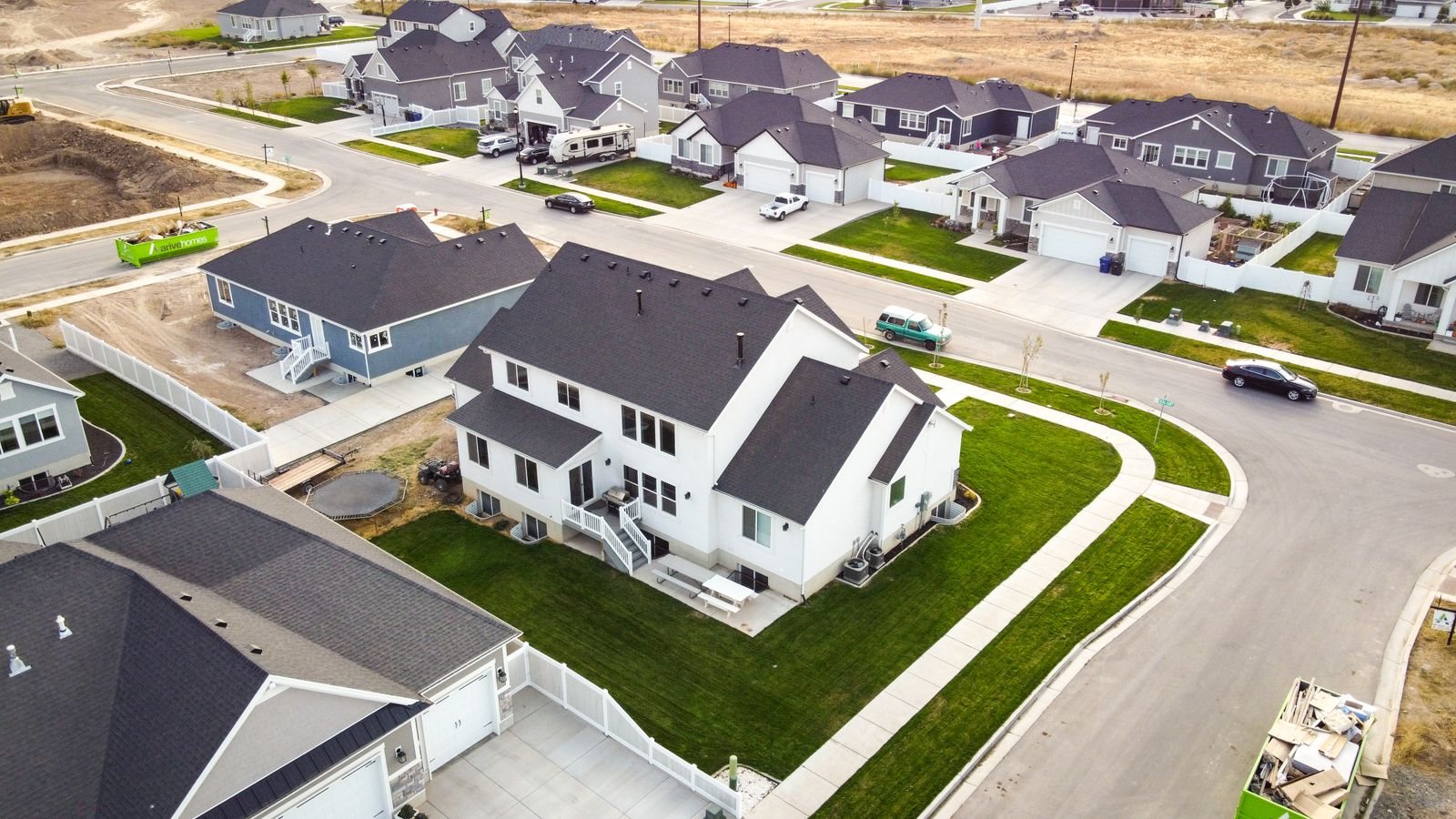 Aerial view of a newer subdivision of single-family homes with curving streets