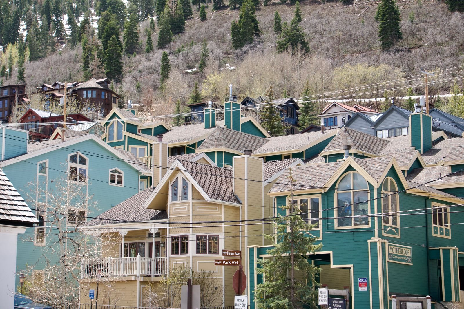 Row of colorful townhomes on a hillside street