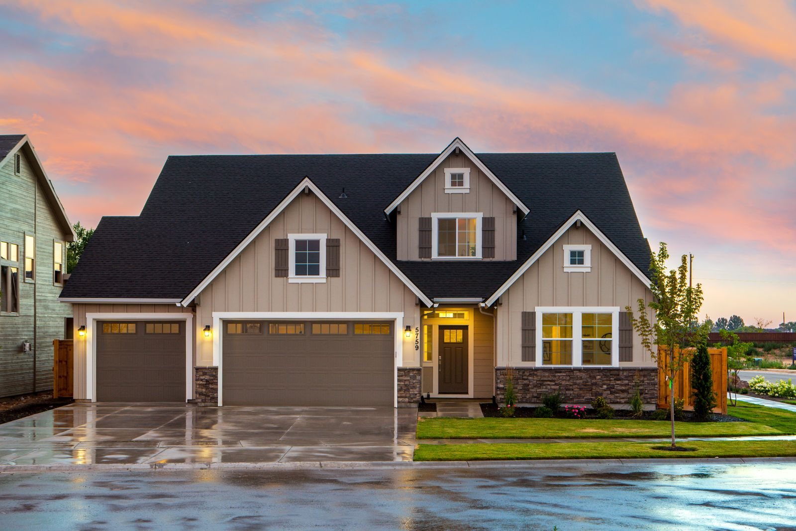 Single-family home with a front lawn and porch on a quiet residential street